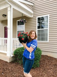 excited military spouse with fabric gardening containers