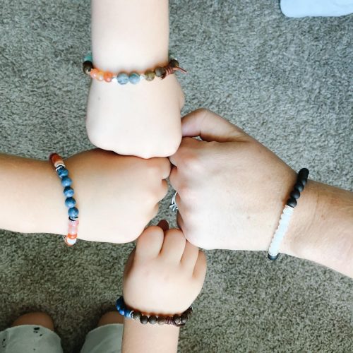 four hands with diffuser bracelets